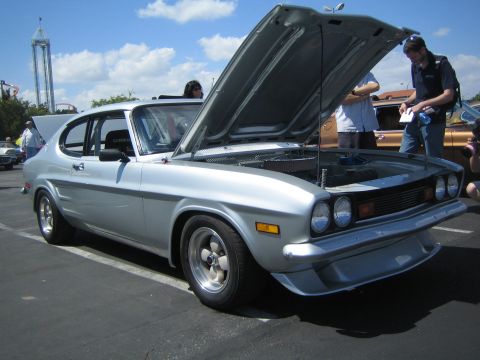 1968 Ford Mustang - A silver coupe is displayed with its hood and trunk open at an outdoor event.