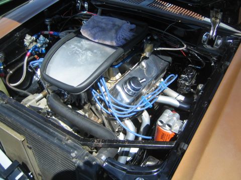 1968 Ford Mustang - Custom V8 engine bay with chrome accents and blue wiring.