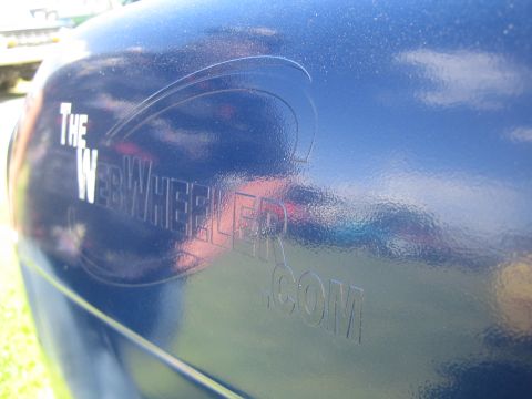 1968 Ford Mustang - Close-up of a blue car's side panel "THE WEBWHEELER.COM" text and a curved graphic.