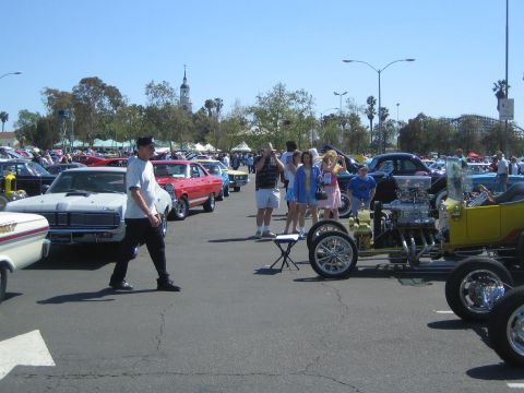 1968 Ford Mustang - A sunny day at a car show with a variety of classic vehicles on display.