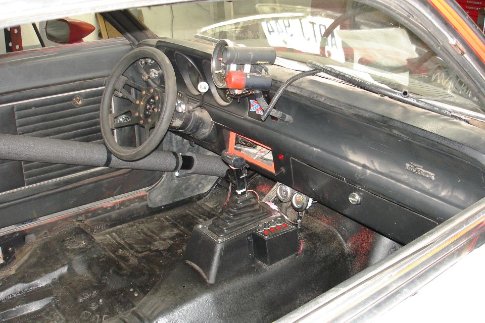 1981 Ford Mustang interior with racing gauges and shifter