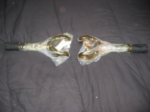 1991 Ford Bronco - Unidentified automotive steering linkage parts shown individually, wrapped in protective plastic.