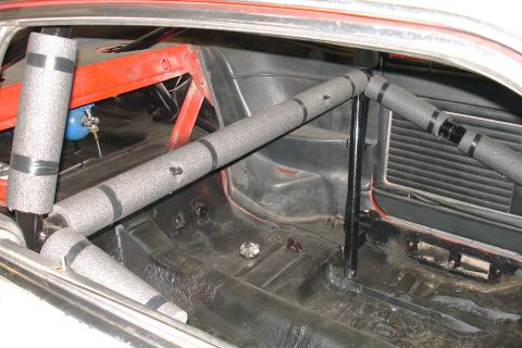 1981 Ford Mustang - The interior of a 1981 Ford Mustang shows a roll cage and racing modifications.