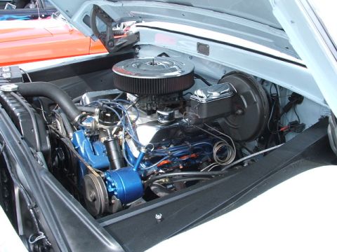 1966 Ford Ranchero - Close-up view of a vehicle's engine bay, showing the engine and related components.