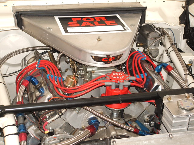 Engine bay with "FOR SALE" sign on air cleaner. MSD ignition components visible