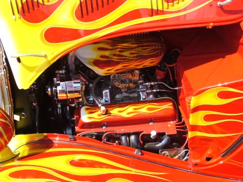 1966 Ford Ranchero - Custom flames paint adorns the engine bay of this hot rod, chrome components and a V8 engine.