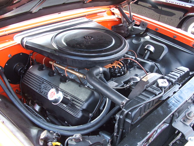 Orange 1966 Ford Ranchero engine bay with Ford V8 engine and air cleaner