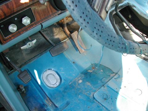 1981 Ford Bronco - Interior view of a vehicle's footwell and dashboard area.