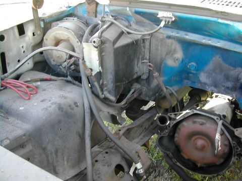 1981 Ford Bronco - Close-up view of engine bay components, including HVAC and transmission parts.
