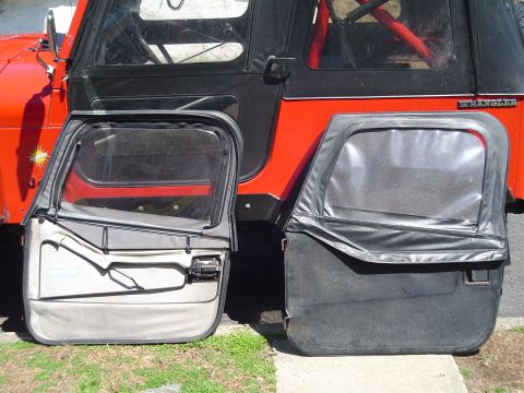 1989 Jeep YJ - Two Jeep YJ doors are shown, one with a black exterior and one with a gray interior.