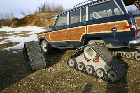 2003 Jeep TJ - A Jeep Grand Wagoneer modified with snow tracks for off-road use in winter conditions.
