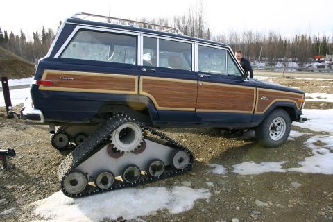 2003 Jeep TJ - This modified Jeep Grand Wagoneer features tank tracks for off-road capability.