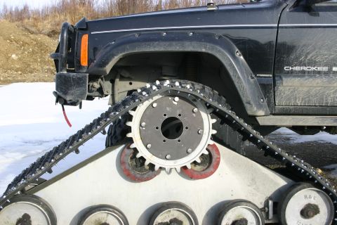 2003 Jeep TJ - A Jeep Cherokee is equipped with a track system for off-road use in snowy conditions.
