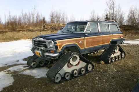 2003 Jeep TJ - This modified Jeep Grand Wagoneer is equipped with tank tracks for off-road capability.