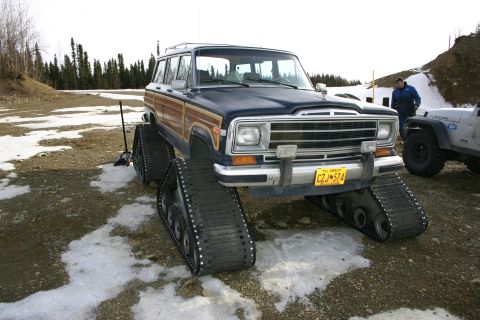 2003 Jeep TJ - This modified Jeep Grand Wagoneer is equipped with tracks for off-road travel in snowy conditions.