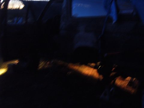1988 Ford Bronco - Rock lights illuminate the undercarriage of a vehicle at night.