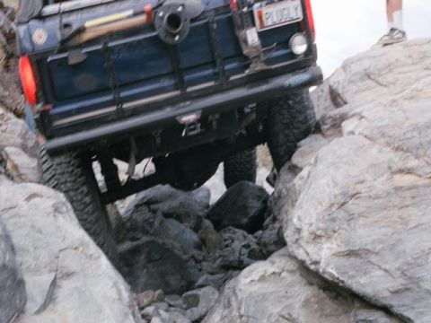 1989 Ford Bronco - This 1989 Ford Bronco navigates a challenging rocky path, its off-road capabilities.