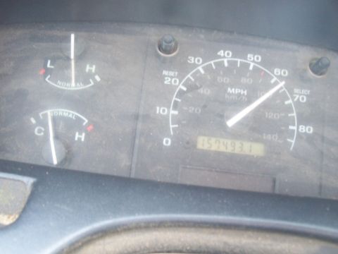 1994 Ford F-150 - Dashboard gauges of a 1994 Ford F-150, including the odometer reading 157,493.1 miles.