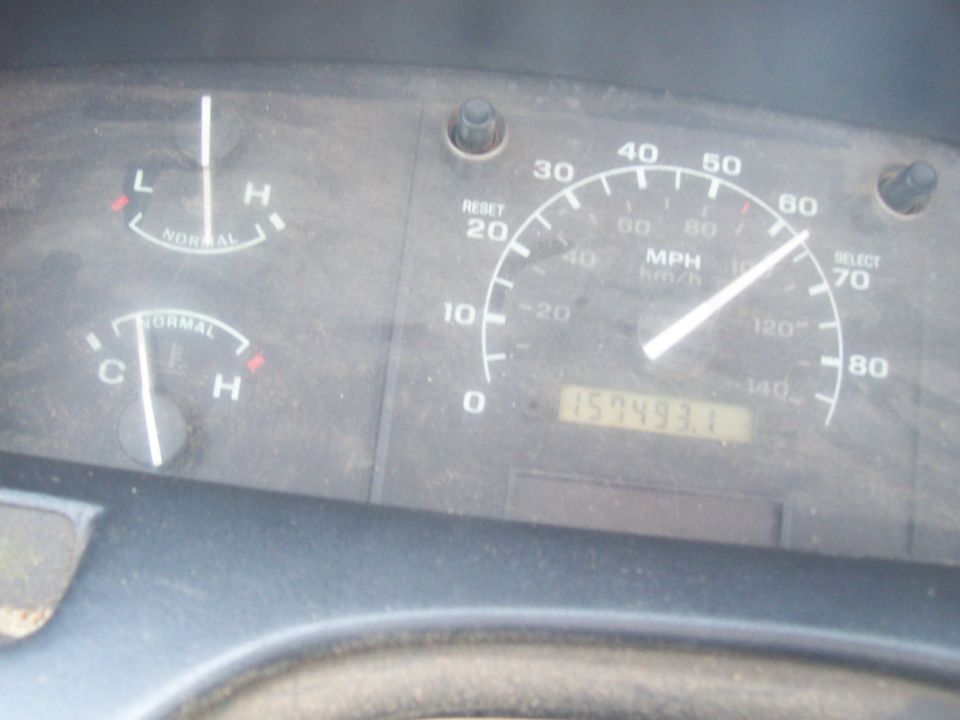 1994 Ford F-150 dashboard with speedometer, odometer showing 157493.1, and temperature/fuel gauges