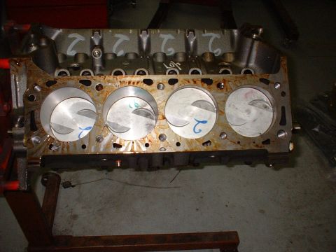 1971 Ford Mustang - Engine block with pistons, showing cylinder bores and piston tops.