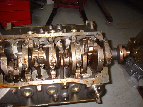 1971 Ford Mustang - Close-up view of an engine's internal components, showing the crankshaft and connecting rods.