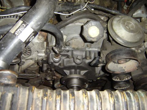 1992 Ford Bronco - A detailed view of the engine compartment, highlighting various mechanical parts and plumbing.