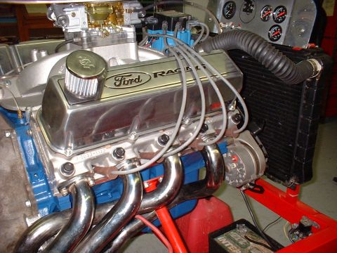1971 Ford Mustang - Close-up of a Ford Racing engine assembly, showing headers and carburetor.