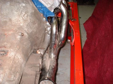 1971 Ford Mustang - This photo shows a close-up view of an engine's exhaust manifold and part of the engine block.