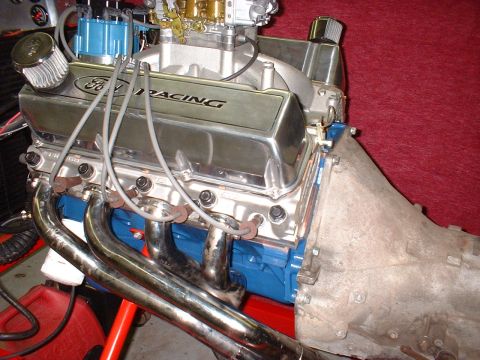 1971 Ford Mustang - Close-up of a Ford V8 engine, chrome valve covers and exhaust headers.