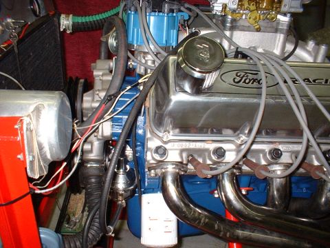 1971 Ford Mustang - Close-up view of a Ford Racing engine, showing chrome valve covers and exhaust headers.