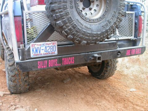 1990 Ford Bronco - Modified truck rear bumper with spare tire and custom decals. License plate is from North Carolina.