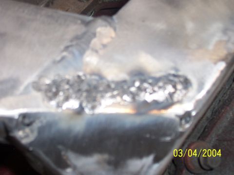 1994 Ford Probe - A close-up view of a metal frame with visible welds, dated March 4, 2004.