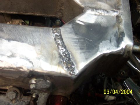 1994 Ford Probe - Close-up view of a welded metal frame, with a date stamp of 03/04/2004 visible.