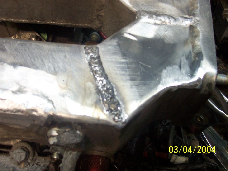 Close-up of welded metal frame with date stamp 03/04/2004