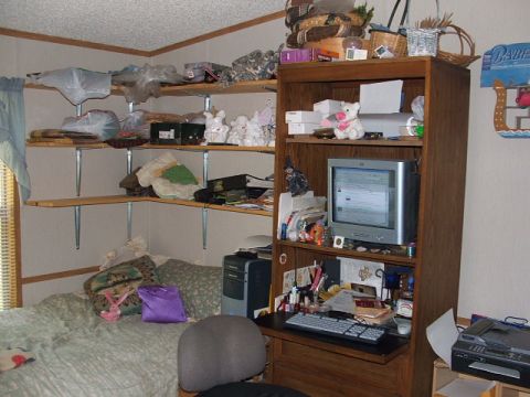 1966 Ford Ranchero - Bedroom scene with shelves, bed, and desk area, showing a disorganized living space.