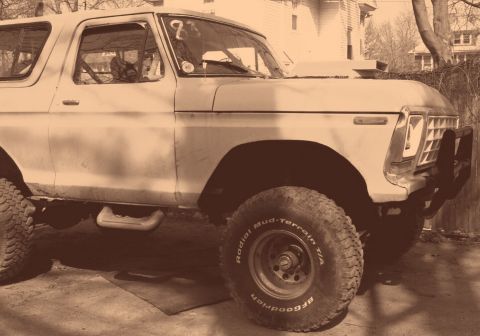 1978 Ford Bronco - This 1978 Ford Bronco is equipped with off-road tires and a brush guard, and appears to have a rollcage inside.