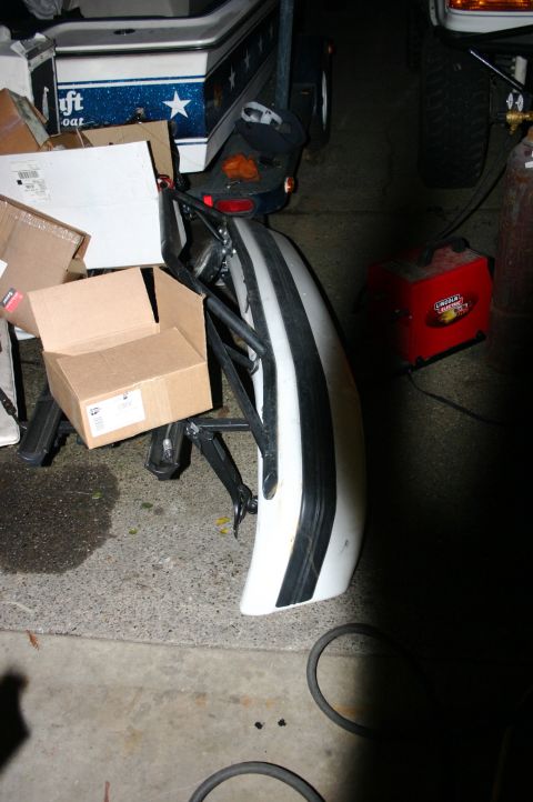 1995 Ford Bronco - A detached white and black striped bumper is shown, possibly for a vehicle.
