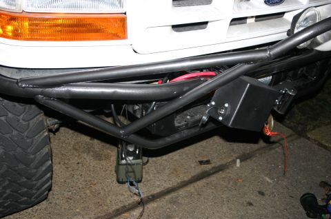 1995 Ford Bronco - A custom front bumper assembly is attached to a Ford truck, a winch and wiring.