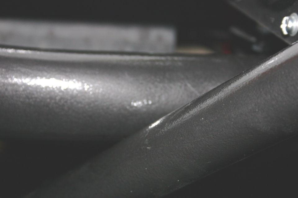 Black interior roll bar with scuff marks