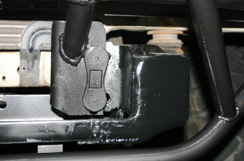 1995 Ford Bronco - Tow hitch receiver assembly on a vehicle frame, showing structural components and attachment points.