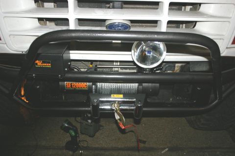 1995 Ford Bronco - Front view of a 1995 Ford Bronco showing the bumper, winch, and a driving light.