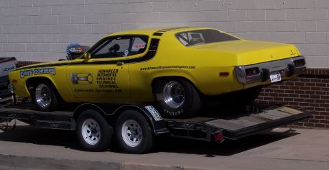 1972 Ford Ranchero - Yellow 1973 Plymouth Duster drag car on trailer, with "Advanced Automotive Engines Technical School" livery.