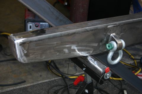 1995 Ford Bronco - Custom metal bumper fabrication in progress, showing a shackle mount and welding equipment.
