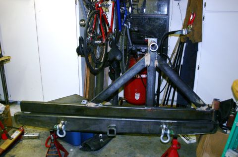 1995 Ford Bronco - A custom fabricated rear bumper and tire carrier assembly is shown, a tow hitch receiver and D-ring shackle mounts.