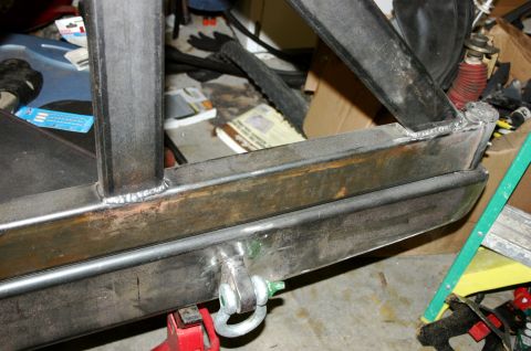 1995 Ford Bronco - Close-up of a custom steel frame section with a tow hitch, likely for an off-road vehicle modification.