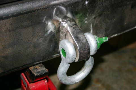 1995 Ford Bronco - Welded tow hitch shackle mount with a green-capped pin, likely for off-road recovery.