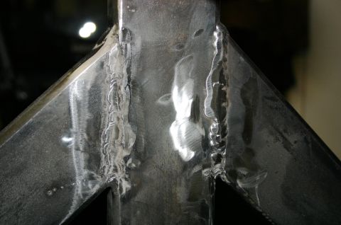 1995 Ford Bronco - Metal bracket with visible welds, likely a component for a vehicle accessory.