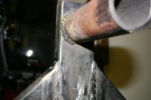 1995 Ford Bronco - This image shows a close-up of a welded metal bracket and pipe, not a 1995 Ford Bronco rear bumper.
