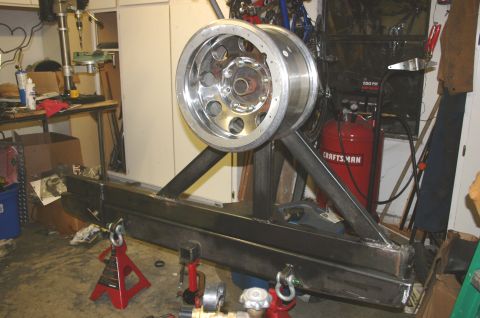 1995 Ford Bronco - Custom fabricated tire carrier and bumper assembly with a large chrome wheel.