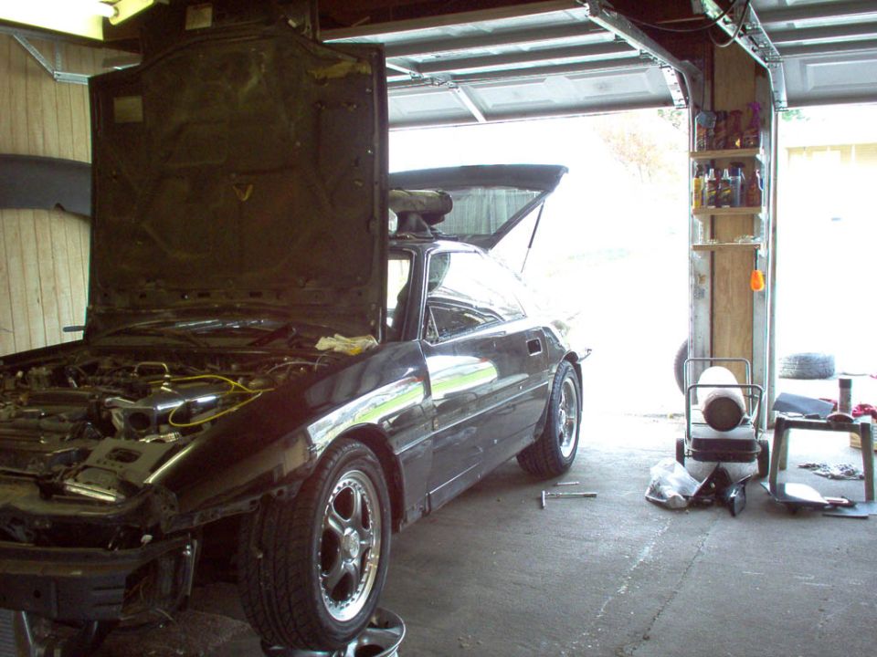SupraMan502's car, getting re-sprayed stock color, PPG wild cherry black
and a little body work